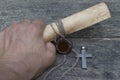 Cross and medieval scrolls.