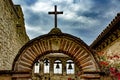 Cross and Mission Bells against a Stormy Sky