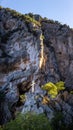 Cross symbol monument on mountain cliff