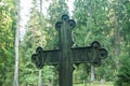 Cross at old beautiful semetery in Finland