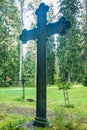 Cross at old beautiful semetery in Finland