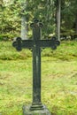 Cross at old beautiful semetery in Finland