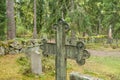 Cross at old beautiful semetery in Finland