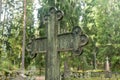 Cross at old beautiful semetery in Finland