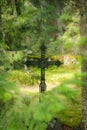 Cross at old beautiful semetery in Finland