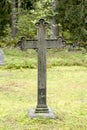 Cross at old beautiful semetery in Finland