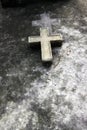 A cross in a old grave in Paris Royalty Free Stock Photo