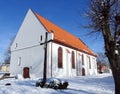 Cross and old rebuild church, Lithuania Royalty Free Stock Photo