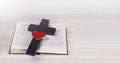 Cross. Open Bible. Holy Bible. Red heart. On a wooden table. Royalty Free Stock Photo