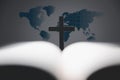 Cross with open Holy Bible on table with world map blur background. mission evangelism and gospel on world. Copy space for text,