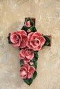 Cross ornament with ceramic flowers in France Royalty Free Stock Photo