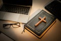 Cross over wood table with window light. online church concept Royalty Free Stock Photo