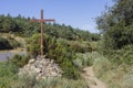 A cross beside the path where the pilgrims walk in the Camino de Santiago, Spain. Royalty Free Stock Photo