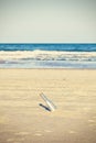 Cross processed photo of a bottle with letter on beach, shallow Royalty Free Stock Photo