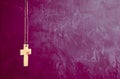 Cross on purple wall background Royalty Free Stock Photo