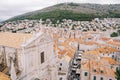 Cross on the red tiled roof of the Cathedral of St. Ignatius. Dubrovnik, Croatia. Drone