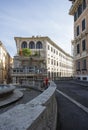 Cross roads and limestone fountain in Rome