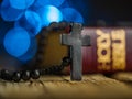 A cross and a rosary against the background of a holy bible on a wooden table in a church with lights from the light.The concept Royalty Free Stock Photo