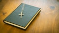 The Cross with the Rosary in the Holy Bible The book is closed, closed with a black cover and Christian symbol on a wooden Royalty Free Stock Photo