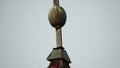 cross on the ruined roof with red ceramides