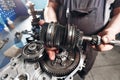 Cross-section of a car gearbox. mechanics work in the garage. hand mechanic in working clothes Royalty Free Stock Photo