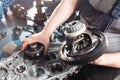 Cross-section of a car gearbox. mechanics work in the garage. hand mechanic in working clothes Royalty Free Stock Photo