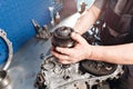 Cross-section of a car gearbox. mechanics work in the garage. hand mechanic in working clothes Royalty Free Stock Photo