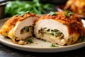 cross-section of cooked stuffed chicken revealing stuffing