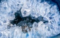 Cross section of natural stone. Blue quartz geode with transparent crystals.