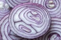 Cross section of red onions. The pattern in nature. Organic food background Royalty Free Stock Photo