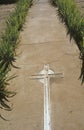 Cross in sidewalk at church in Taos Pueblo New Mexico Royalty Free Stock Photo