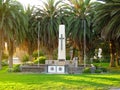 Cross sign and palm trees on the german monument in Swakopmund, Namibia