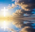 Cross silhouette against sky.