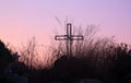 Cross Silhouette inside a field at Sunset Royalty Free Stock Photo