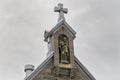 Cross sitting on top of church steeple Royalty Free Stock Photo