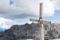 Cross with sky and mountains in background