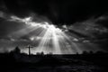 Cross in the sky with rays of light coming out of the clouds Royalty Free Stock Photo