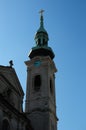 The cross standing tall atop the church steeple