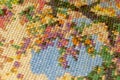 Cross-stitch. Macro photography of embroidery sites. Shooting with a small bluff of sharpness