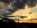 Cross with sun set background Royalty Free Stock Photo