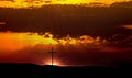 Cross at sunset in the mountains Royalty Free Stock Photo