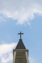 A cross on top of a church tower Royalty Free Stock Photo