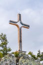 A cross on top of Hahnenkamm mountain