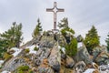 A cross on top of Hahnenkamm mountain