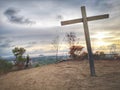 A cross on the top of the hill before the sunset fall. Royalty Free Stock Photo