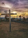 A cross on the top of the hill before the sunset fall. Royalty Free Stock Photo