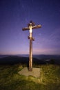 Cross on top of the mountain and stars Royalty Free Stock Photo