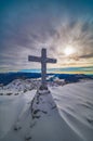 Cross at the top of a mountain in winter Royalty Free Stock Photo