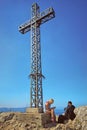 Cross and the tourists at Pic Saint-Loup mountain