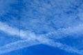 Cross trail of condensation in the sky Royalty Free Stock Photo